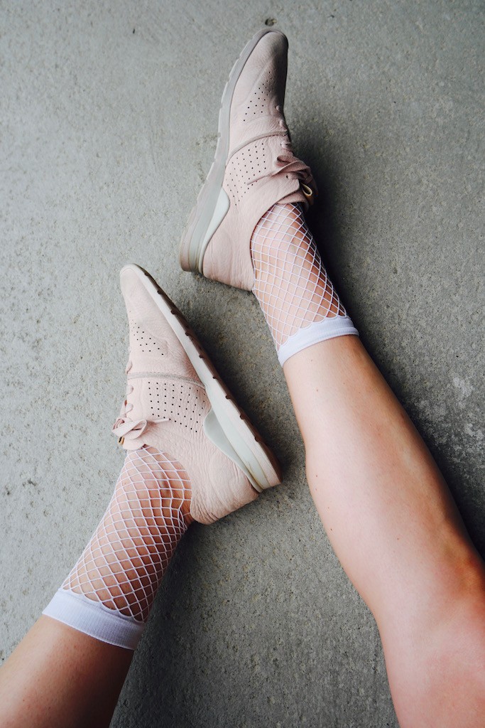 Fishnets + UGG sneakers